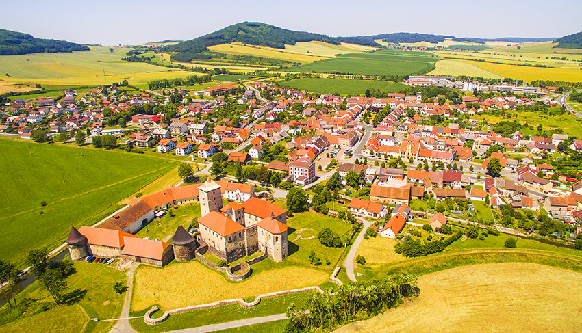 Aerial view of gothic castle Svihov with small town in Czech Republic. Central Europe.